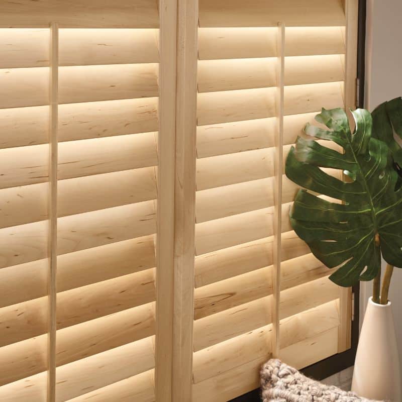 natural wood shutters with plant