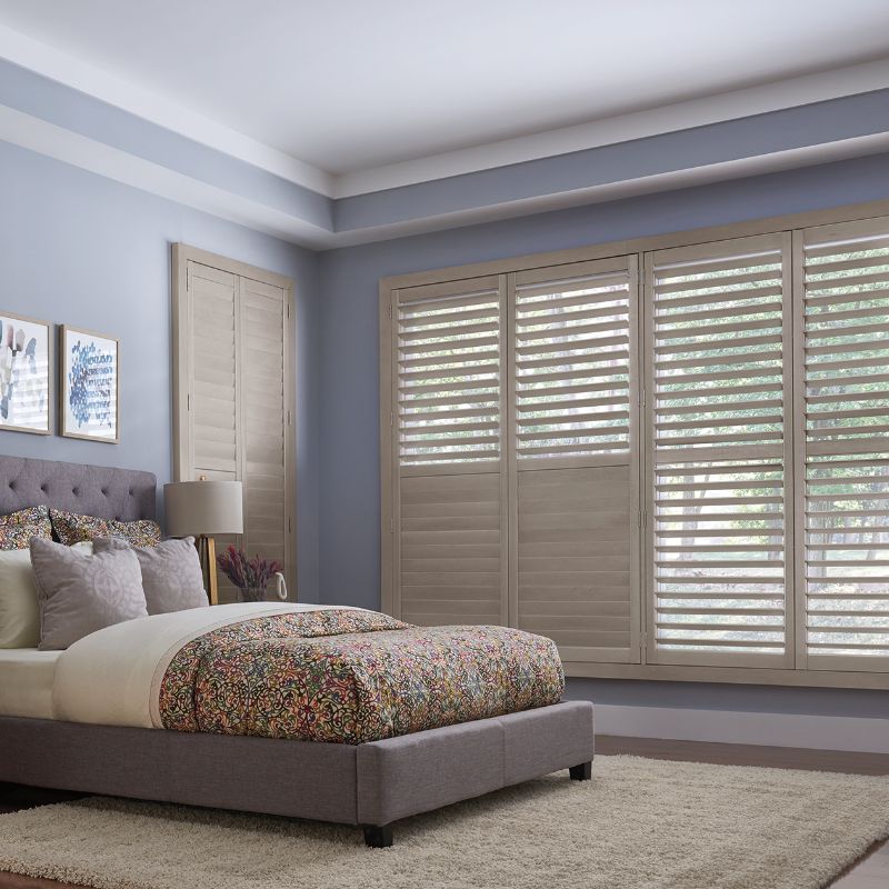 natural wood shutters in lavender bedroom with bed